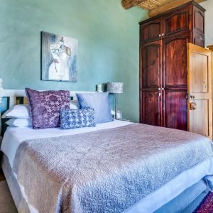 Beautifully decorated bedroom with modern furnishings and soft lighting, perfect for a serene atmosphere.